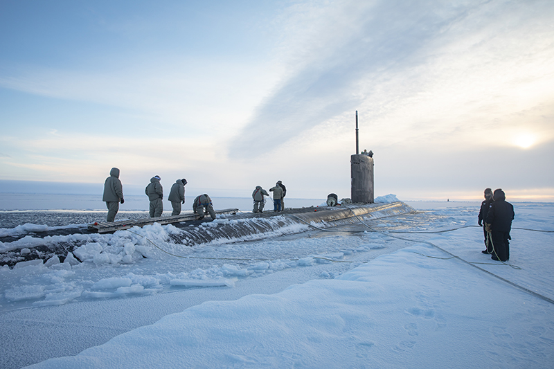 BWXT BEAUFORT SEA, Arctic Circle (March 5, 2022) Sailors assigned to the Los Angeles-class attack submarine USS Pasadena (SSN 752) lay down a brow after mooring to an ice sheet approximately 170 nautical miles offshore in the Arctic Ocean during Ice Exercise (ICEX) 2022. ICEX 2022 is a three-week exercise that allows the Navy to assess its operational readiness in the Arctic, increase experience in the region, advance understanding of the Arctic environment, and continue to develop relationships with other services, allies, and partner organizations. (U.S. Navy photo by Mass Communication Specialist 1st Class Alfred Coffield)