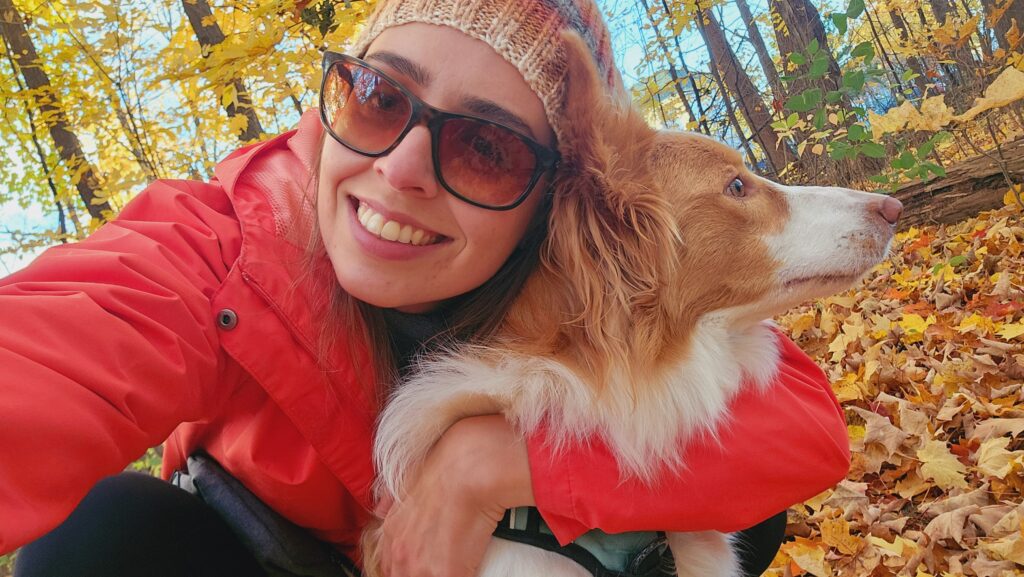 Caroline Manto Chagas poses with her dog while participating in the Tackle Cancer challenge