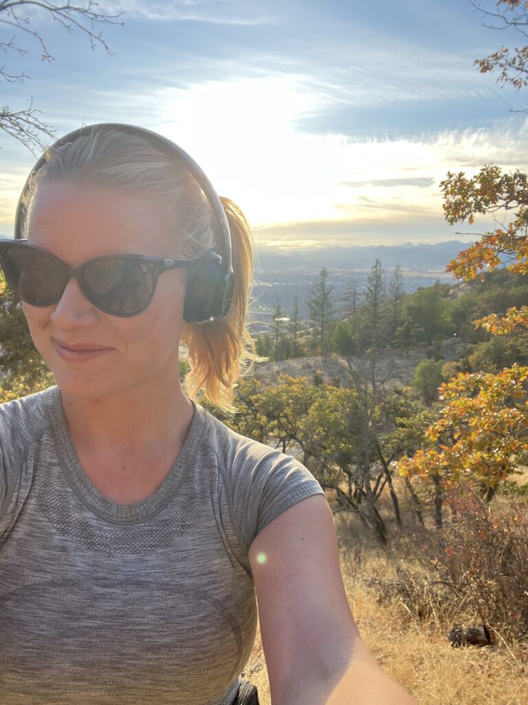 Darby Groen takes a photo of herself on a hike while participating in the Tackle Cancer challenge
