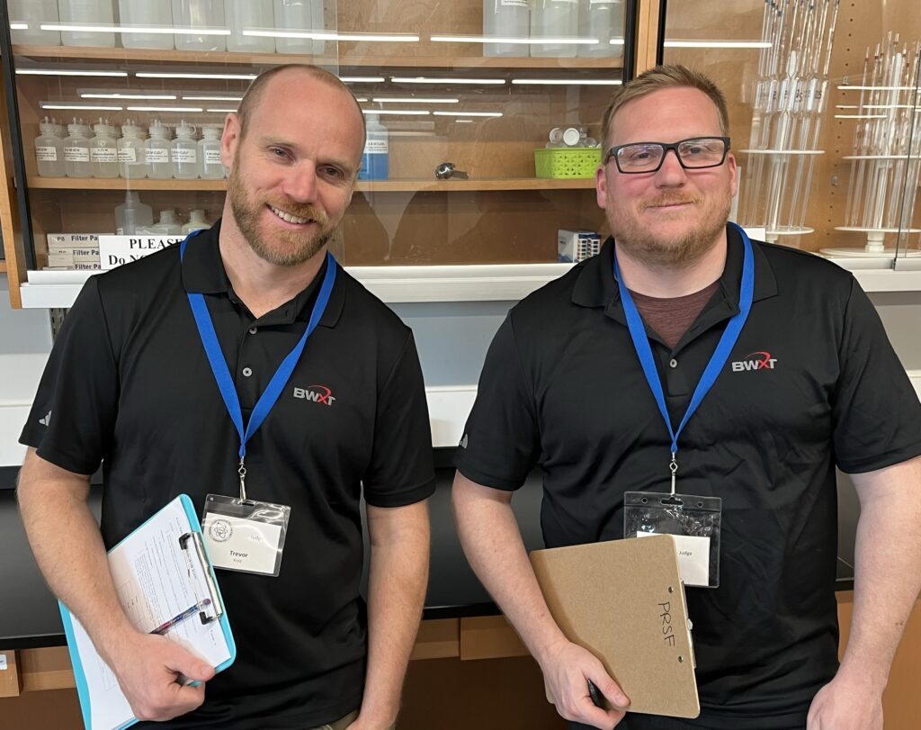 Employees at the science fair.